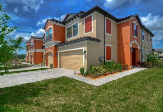 view of front facade featuring a garage and a lawn