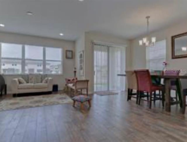 dining room featuring a chandelier and hardwood / wood-style flooring