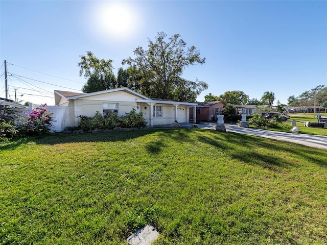 single story home featuring a front yard