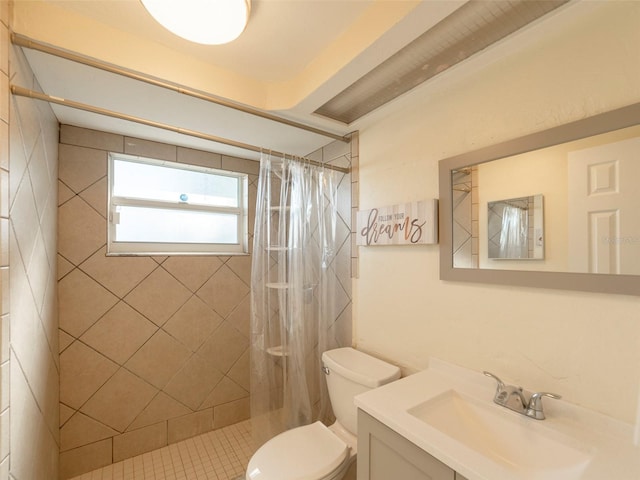 bathroom featuring vanity, a shower with shower curtain, and toilet