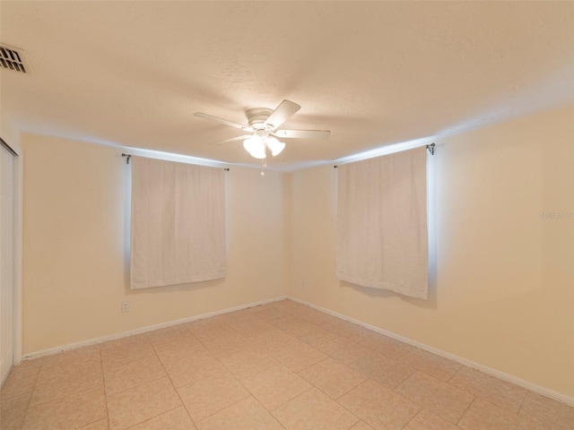 spare room with ceiling fan