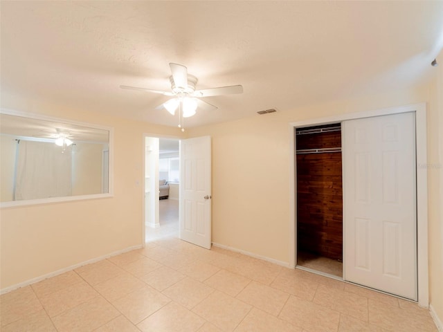 unfurnished bedroom featuring a textured ceiling, a closet, and ceiling fan