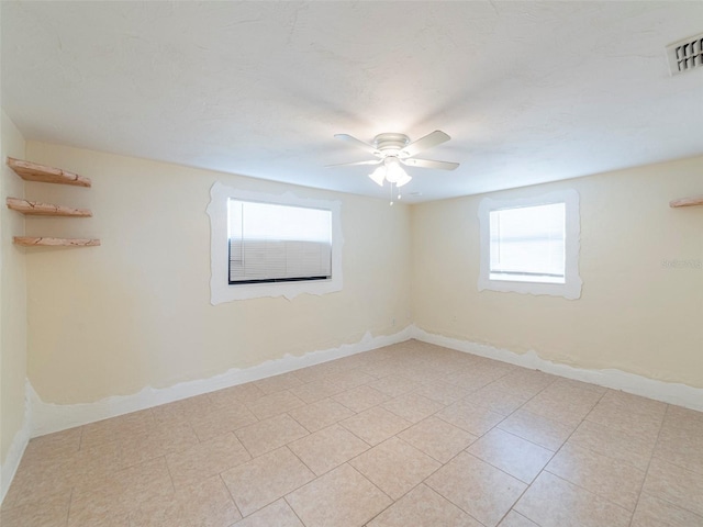 empty room featuring ceiling fan