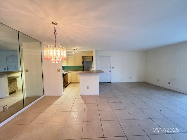 kitchen with pendant lighting, a kitchen island, stainless steel refrigerator, a chandelier, and light tile patterned flooring