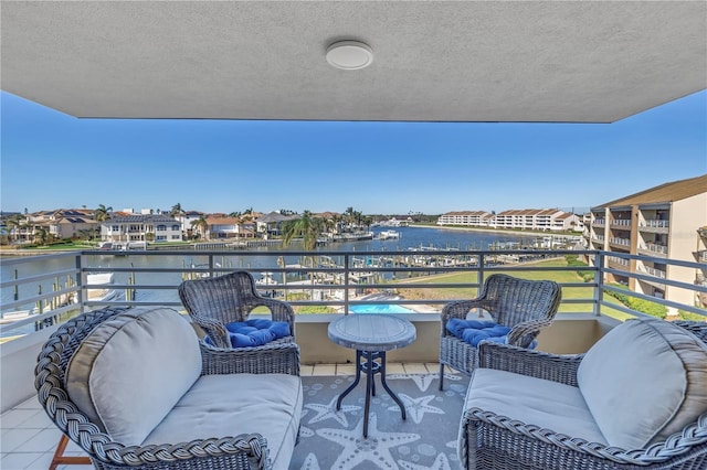 balcony featuring a water view