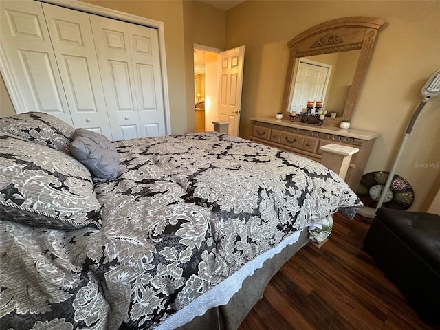 bedroom featuring dark hardwood / wood-style flooring and a closet