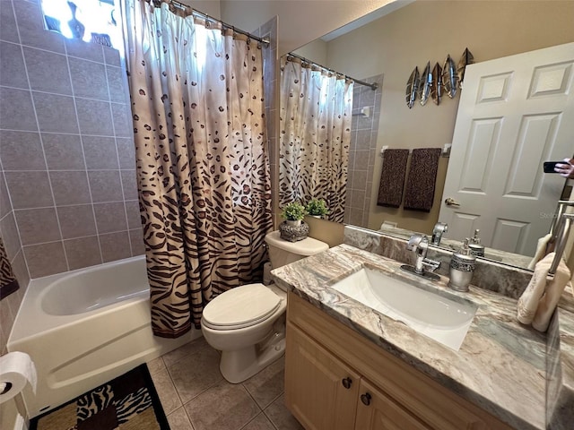 full bathroom featuring vanity, toilet, tile patterned floors, and shower / tub combo with curtain