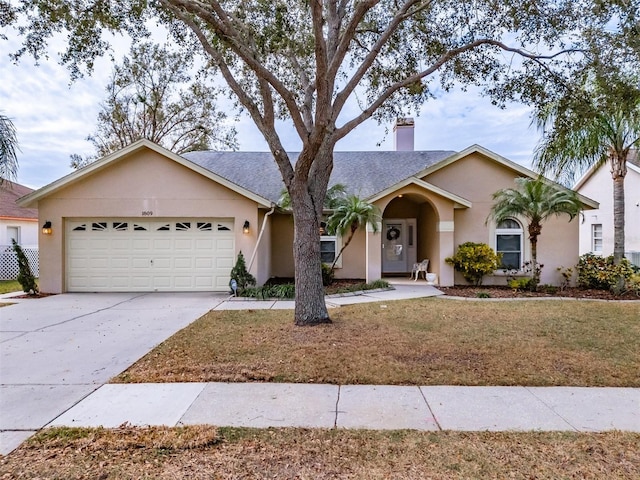 ranch-style house with a garage and a front yard