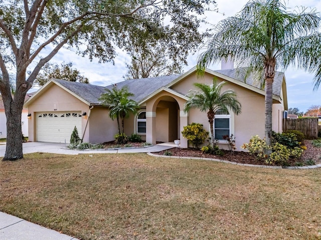 ranch-style house with a front lawn and a garage