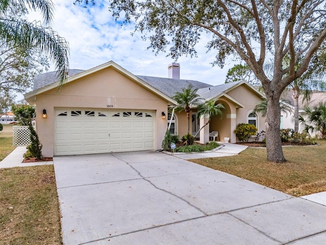 ranch-style house with a front yard and a garage