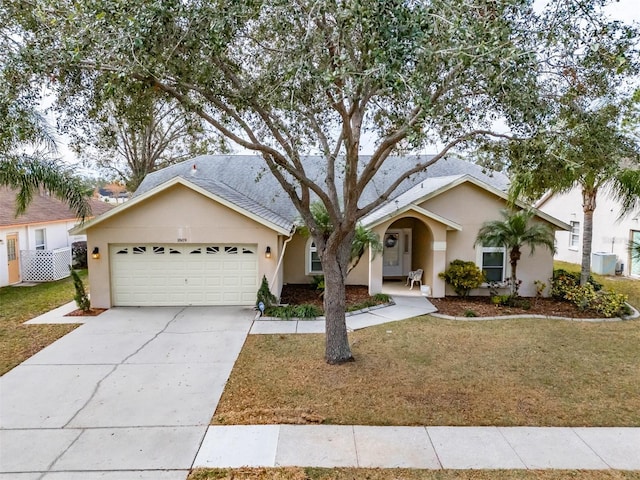 ranch-style home with a front lawn and a garage