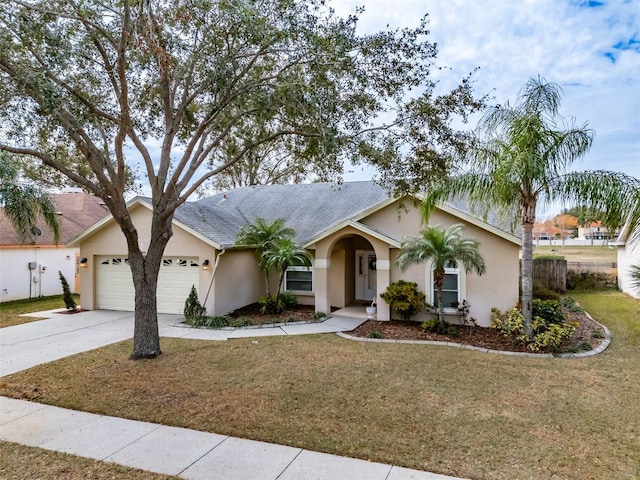 single story home with a front lawn and a garage