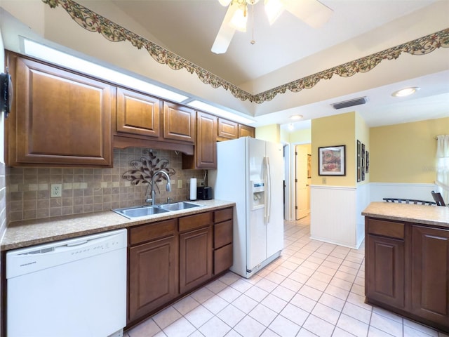 kitchen with white appliances, decorative backsplash, sink, light tile patterned flooring, and ceiling fan