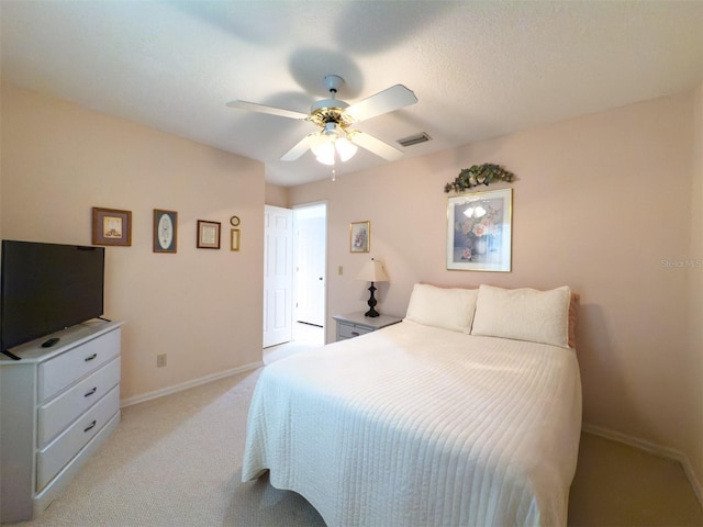 bedroom featuring ceiling fan and light colored carpet