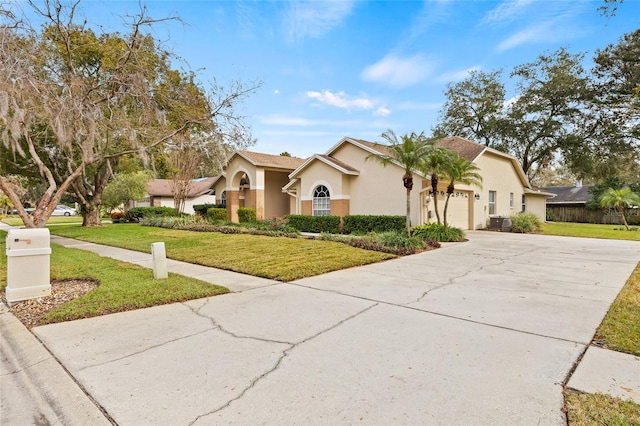 view of front of home with a garage and a front yard