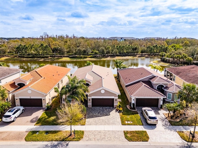 birds eye view of property featuring a water view