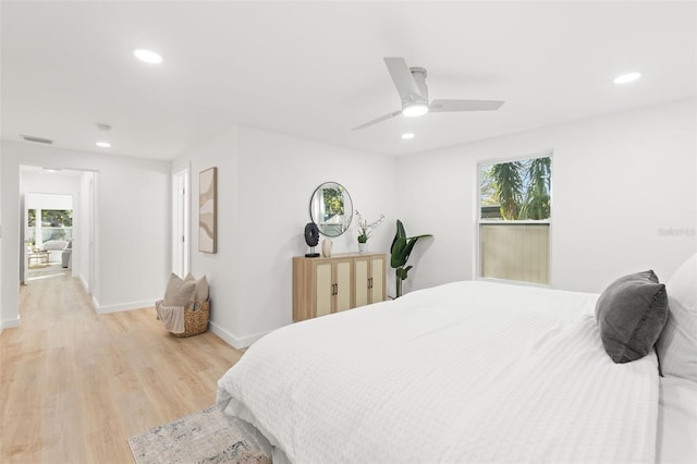 bedroom featuring ceiling fan and light hardwood / wood-style flooring