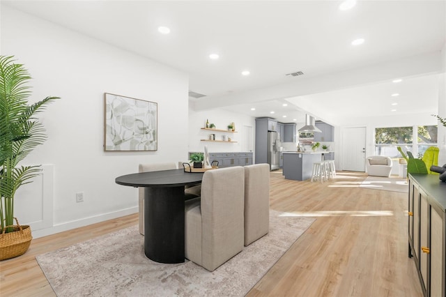 dining room with light hardwood / wood-style floors