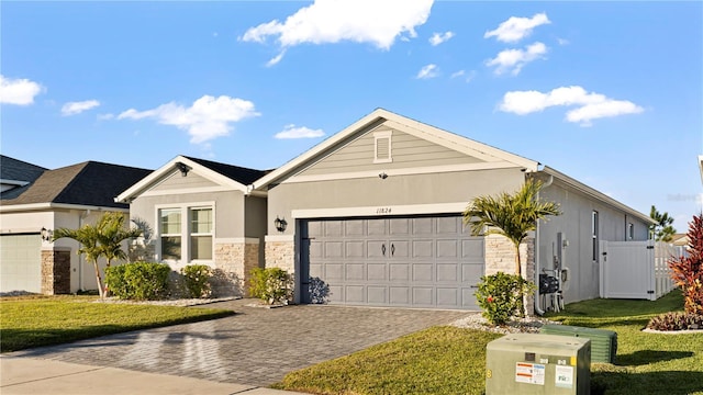 view of front of property featuring a garage and a front yard