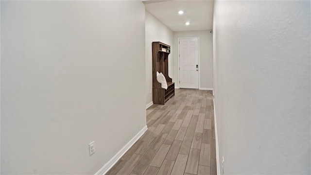 corridor featuring light hardwood / wood-style flooring