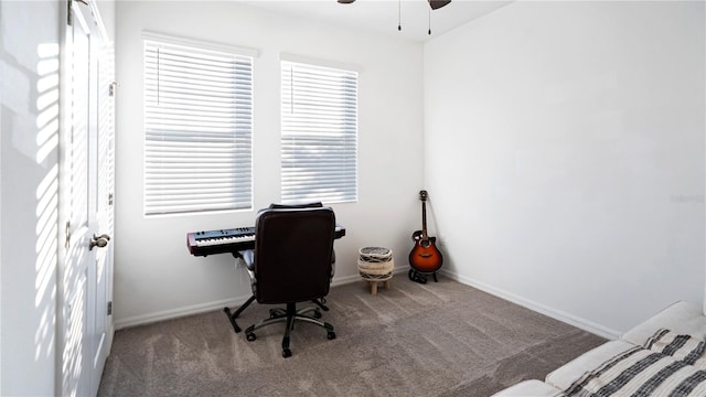 carpeted office with ceiling fan