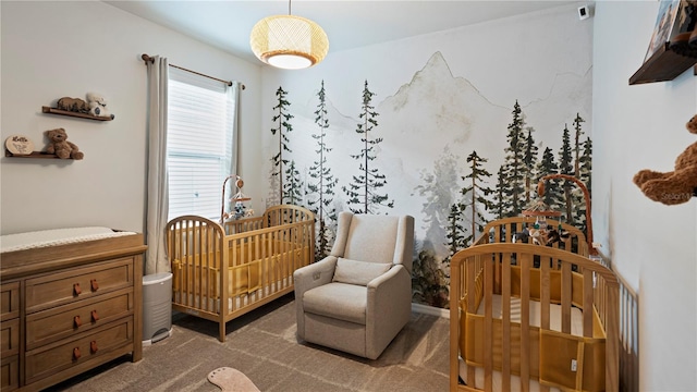 bedroom with carpet floors and a nursery area