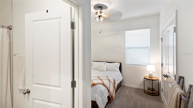 bedroom with dark colored carpet and ceiling fan