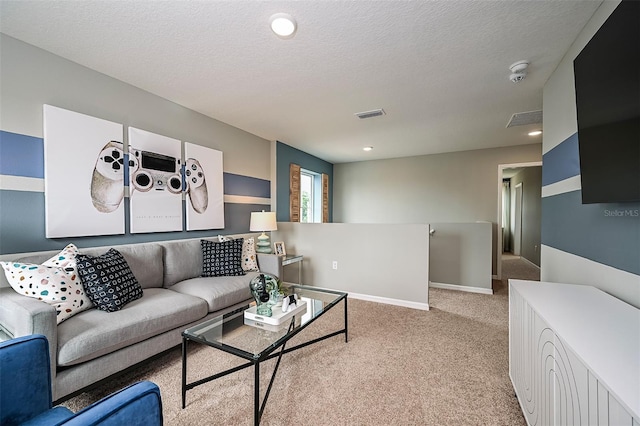 living room with light colored carpet and a textured ceiling