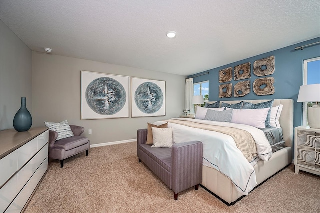 carpeted bedroom featuring a textured ceiling