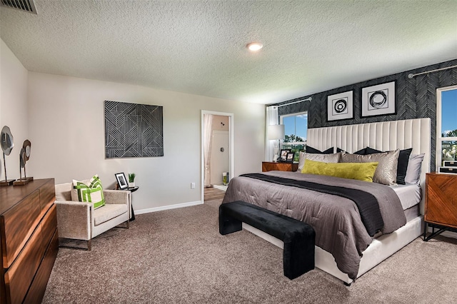 carpeted bedroom with a textured ceiling