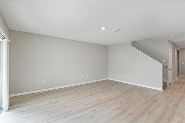 unfurnished living room featuring light hardwood / wood-style flooring