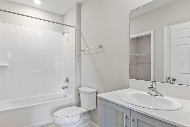 full bathroom featuring toilet, vanity, and shower / tub combination