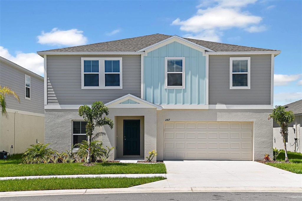 view of front of property with a garage