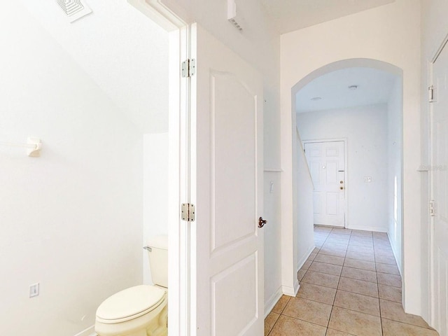 bathroom featuring tile patterned flooring and toilet