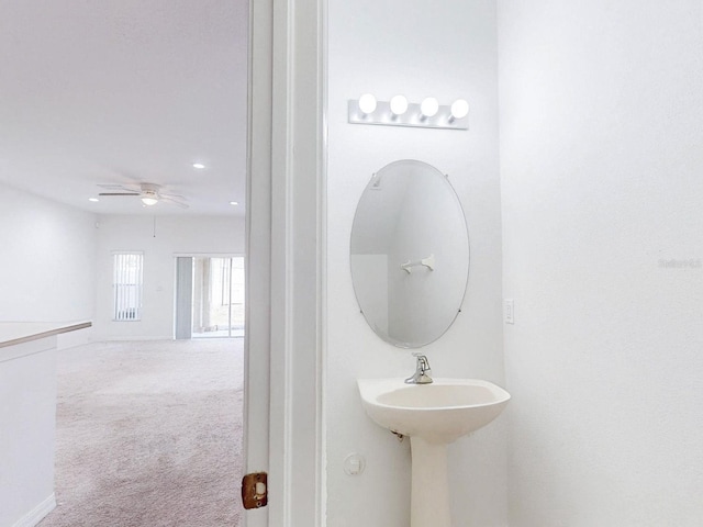 bathroom with ceiling fan and sink