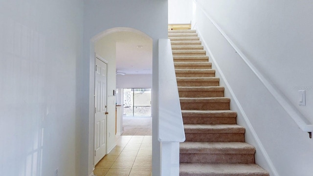 stairs with tile patterned floors