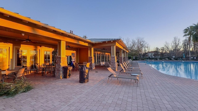 view of pool featuring ceiling fan and a patio