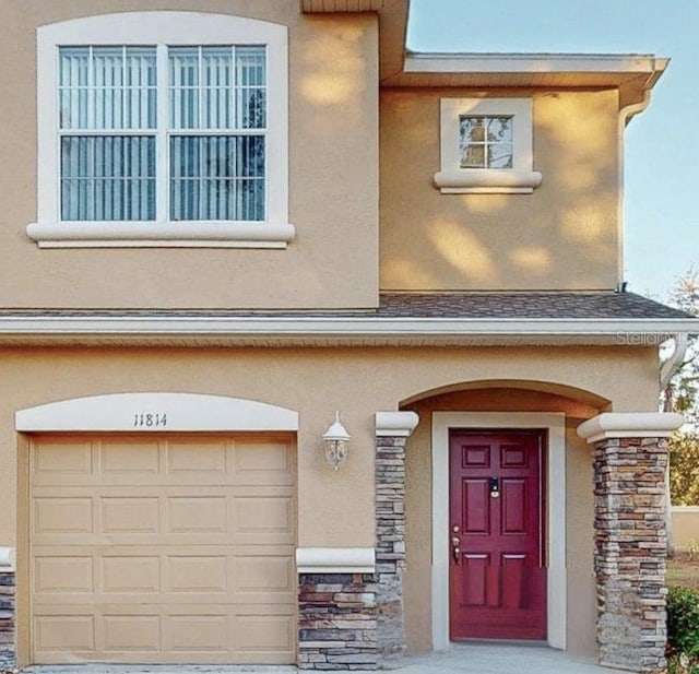 view of exterior entry featuring a garage