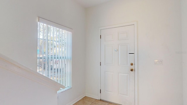 foyer featuring light tile patterned floors