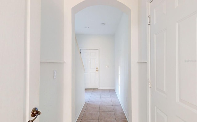 corridor with light tile patterned floors