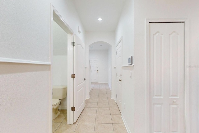 corridor featuring light tile patterned floors