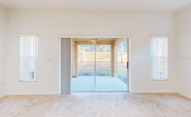 unfurnished room with light carpet