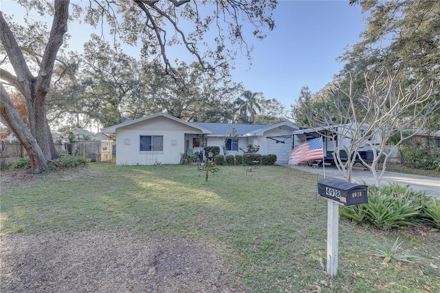 ranch-style house with a front lawn and a garage