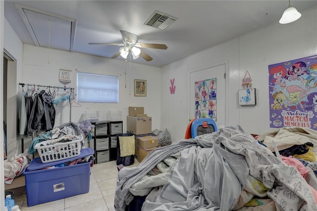 tiled bedroom featuring ceiling fan