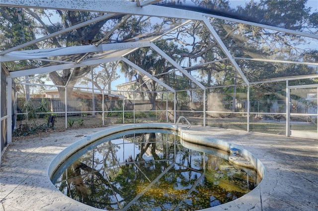 view of pool featuring a lanai