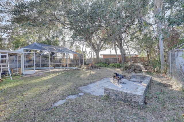 view of yard with a lanai and a patio area