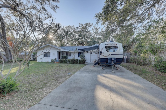 view of front facade with a front lawn and a garage