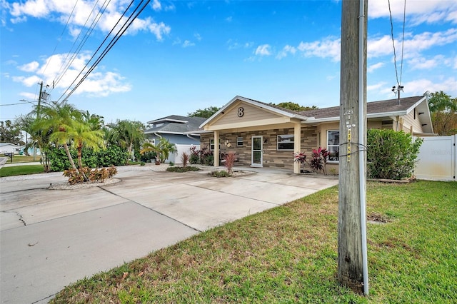 ranch-style home with a front lawn