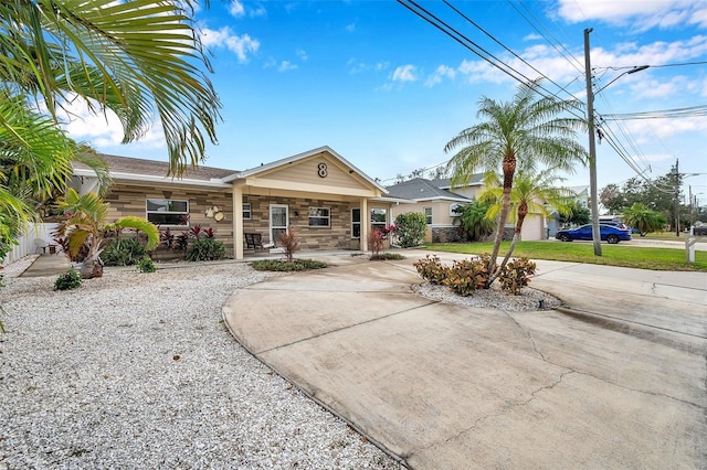 single story home with covered porch