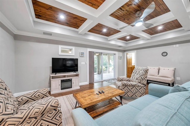 living room featuring beam ceiling, ceiling fan, coffered ceiling, crown molding, and wood ceiling